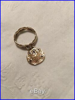 James Avery 14 K Gold Twisted Dangle Sand Dollar Ring Size 5. RETIRED
